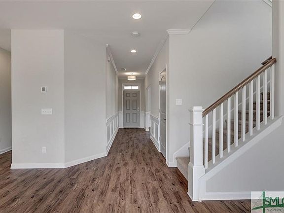 View of the foyer and access to stairway from the great room