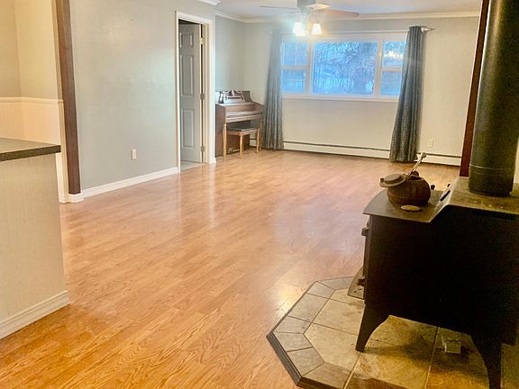 Dining Room with wood stove and piano