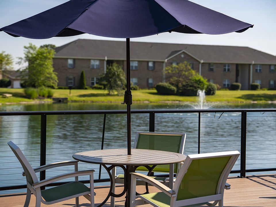 Enjoy peaceful moments on your private deck, overlooking a serene pond and surrounded by nature.