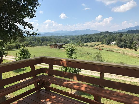 The deck offers relaxing views of the valley and mountain ranges.