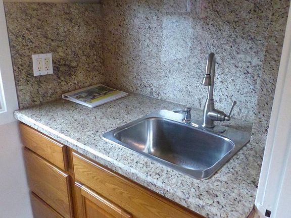 minimal kitchen. No stove. Microwave, hot plate, toaster oven cooking.