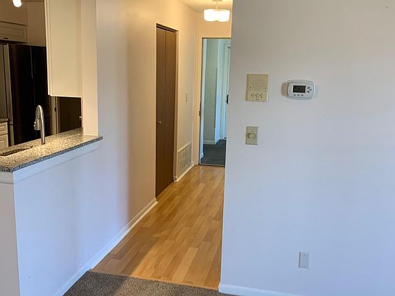 View of entry hallway- coat closet on left
