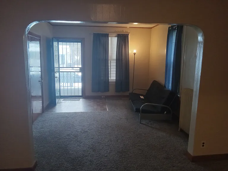 View from Dining Room into the Living Room showing front door