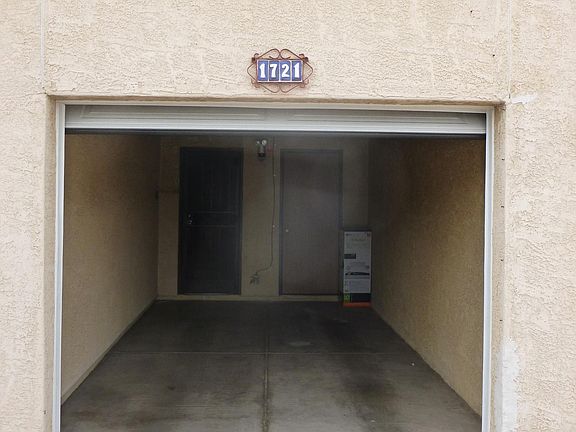 1 car garage with garage door (automatic opener) with storage room and security door entry to house