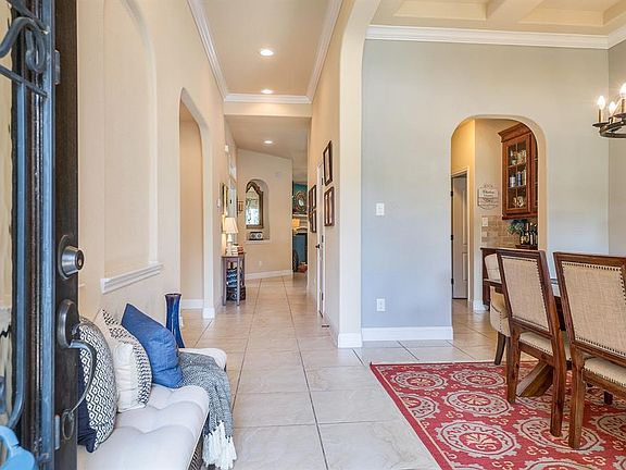 The entry, Dining room, Butler's pantry, Laundry, Kitchen, Breakfast, Bathrooms and traffic ways are equipped with Durable, Oversized tile floors.