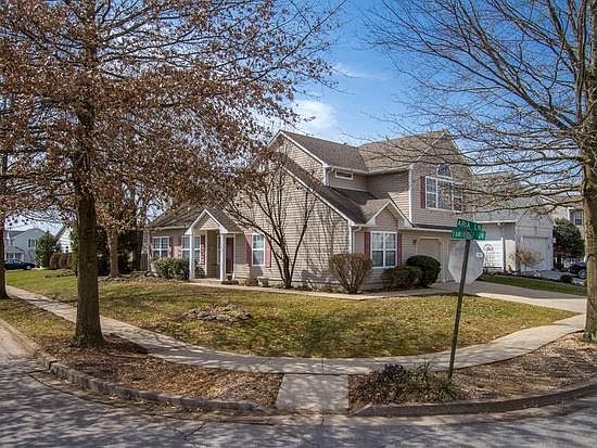 Front and side of home with 2 car garage with double remote openers.