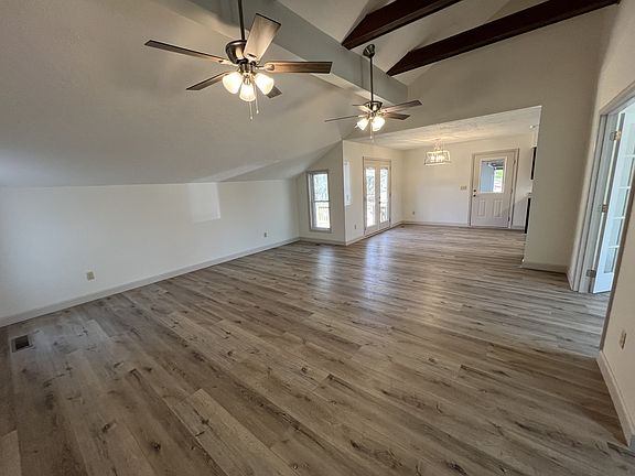 Livingroom and Dining room. Office in first set of french doors to the right. Kitchen backgrd right