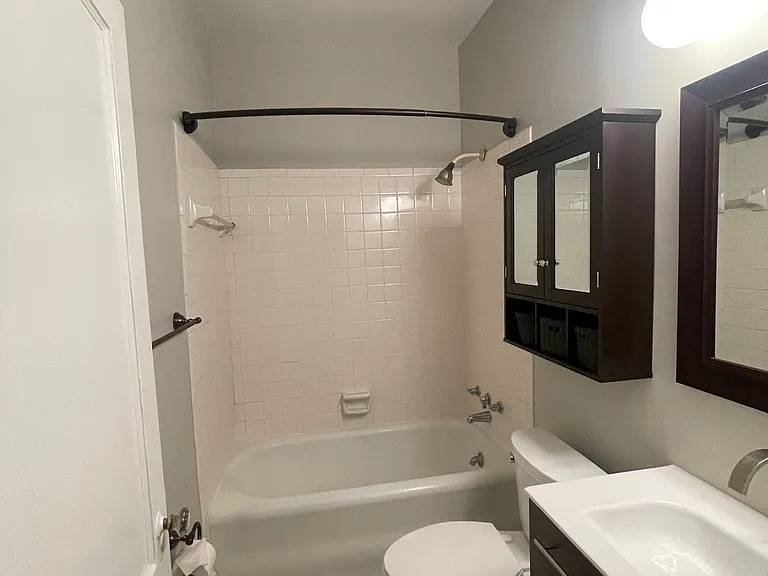 new bath vanity with marble top and contemporary 3 light fixture