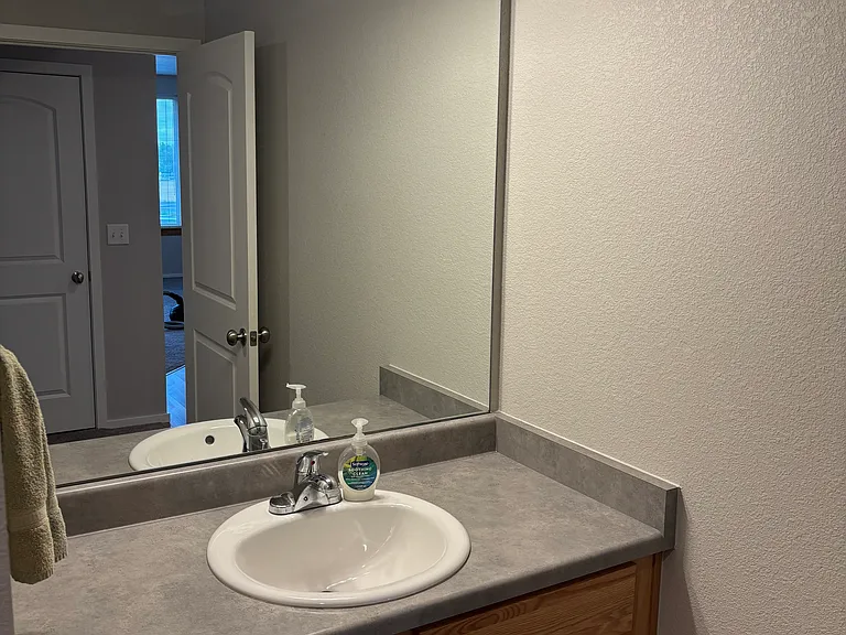 Well-lit bathroom sink.