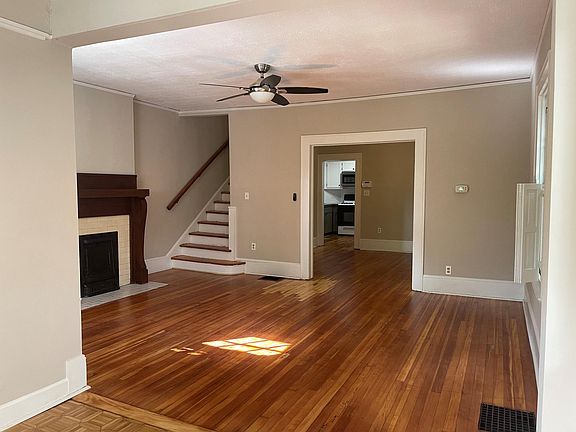 living room, looking through dining room to the kitchen