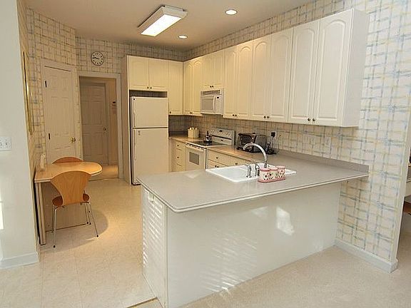 Kitchen features snack counter, pantry