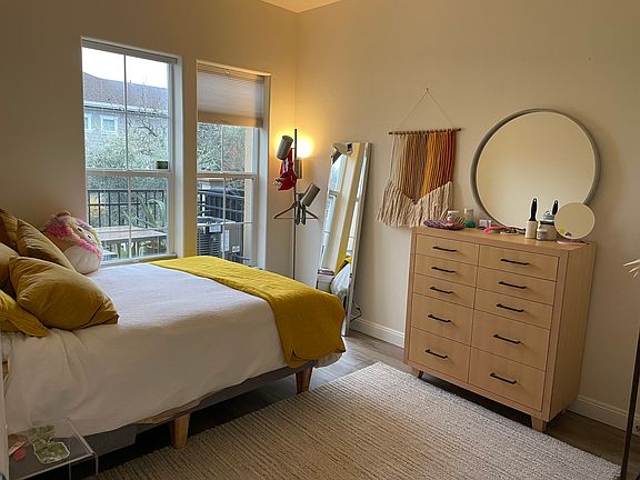 Downstairs bedroom with walk-in-closet with closet organizers