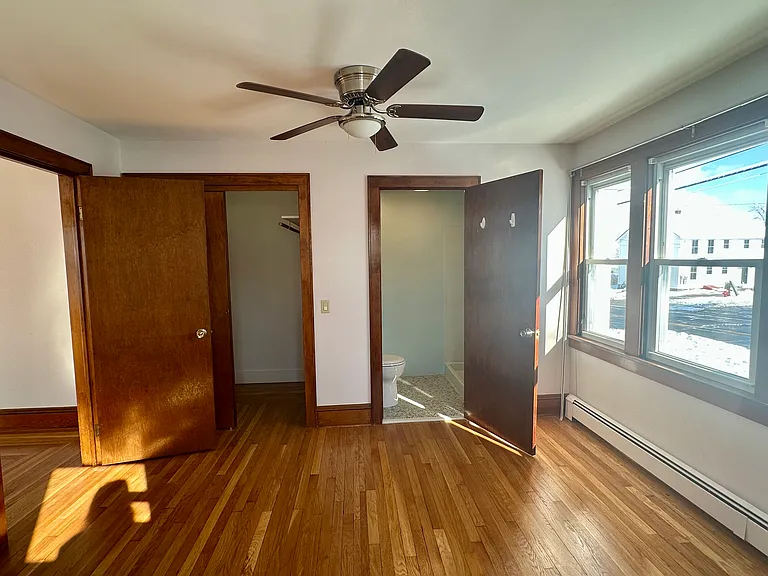 Ensuite bedroom with renovated bathroom and walk-in closet