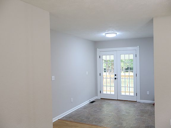 Dining area with doors leading to back deck