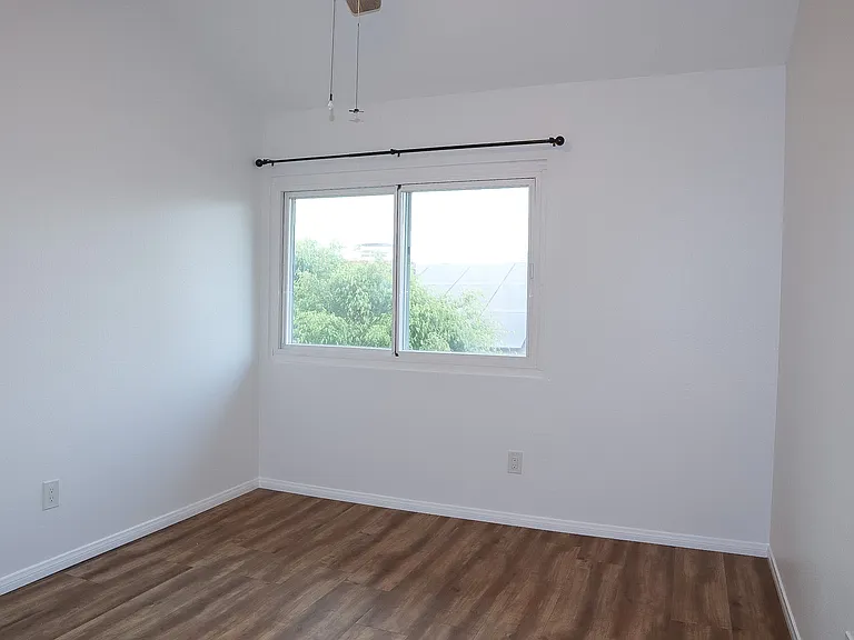 Bedroom #1 with vaulted ceilings.
