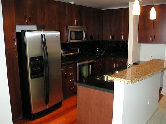 Kitchen with Cherry accented cabinets and SS appliances