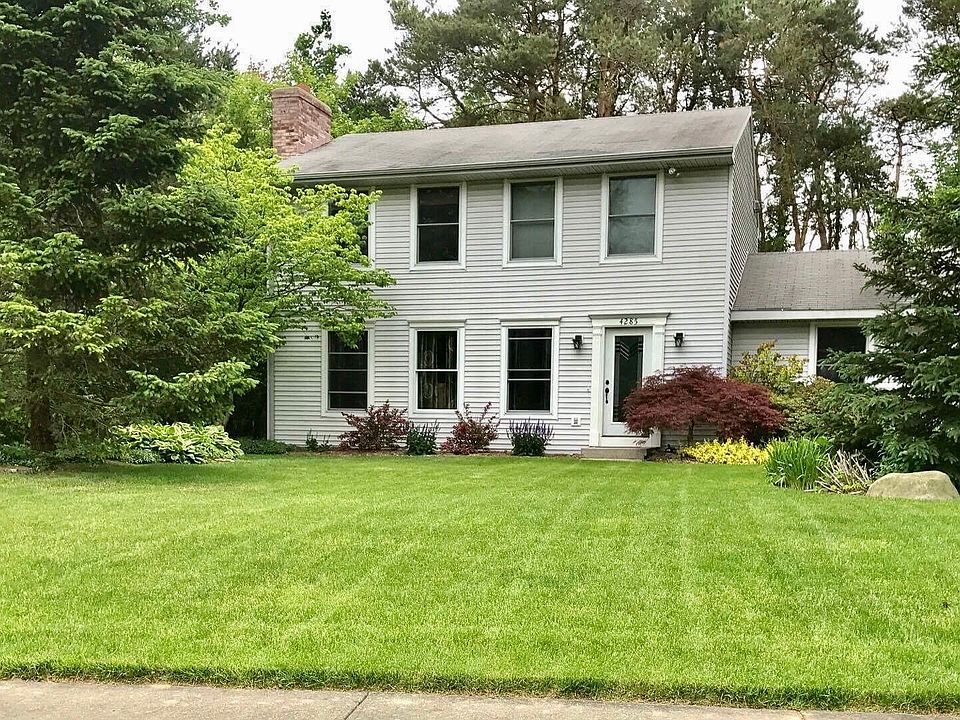 Nestled on a wooded lot