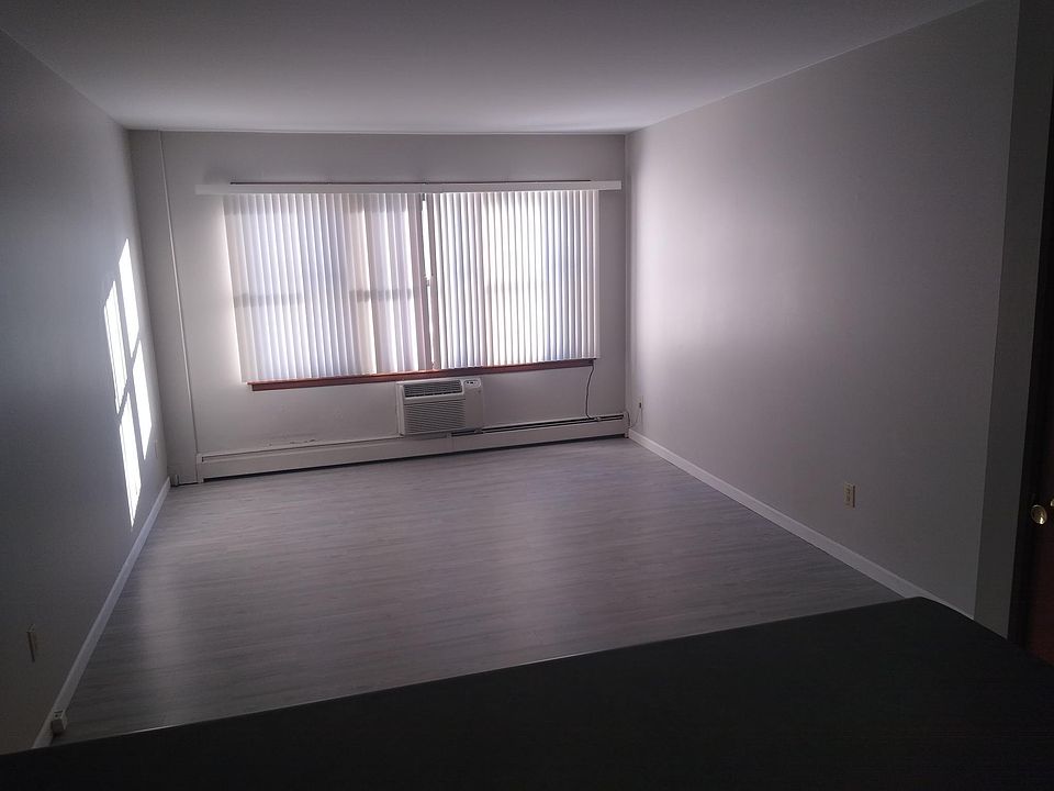 Loads of light in the living room. Modern plank flooring throughout the apartment.