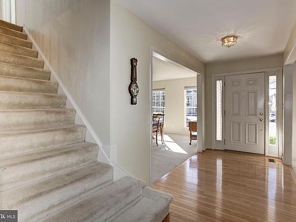 Wide Staircase and Open Foyer.