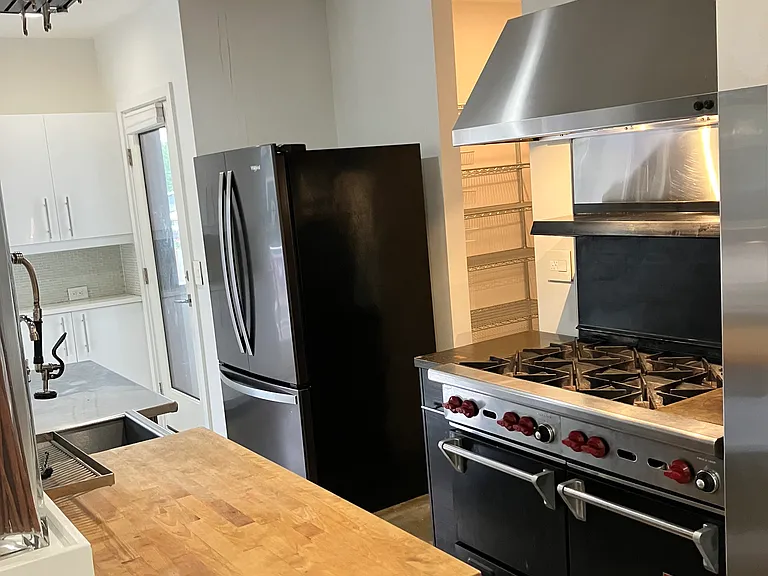 Behind the white kitchen is this more commercial /industrial kitchen...let the chef in you come out!