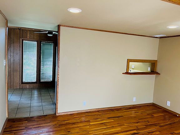 Downstairs living area, straight leads you to kitchen on the right and the first floor bedroom and bathroom on the left.