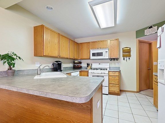 Large, open kitchen provides plenty of storage and meal prep space