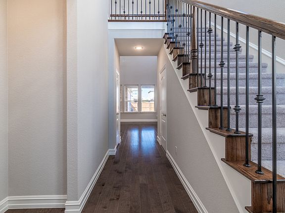 Entryway with wood flooring.