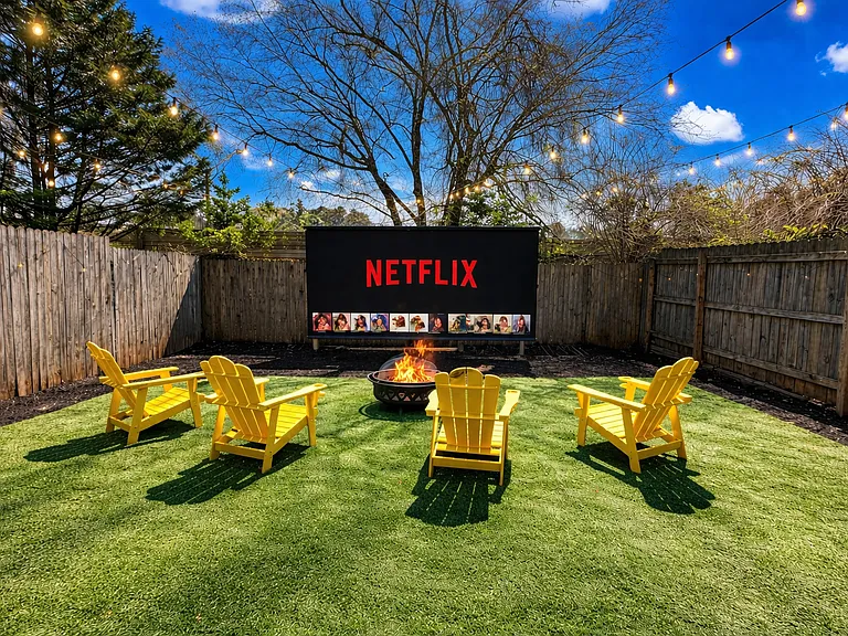Welcome to where the magic happens: the backyard! Your private year-round outdoor retreat features a 150" cinema, fire pit and games.