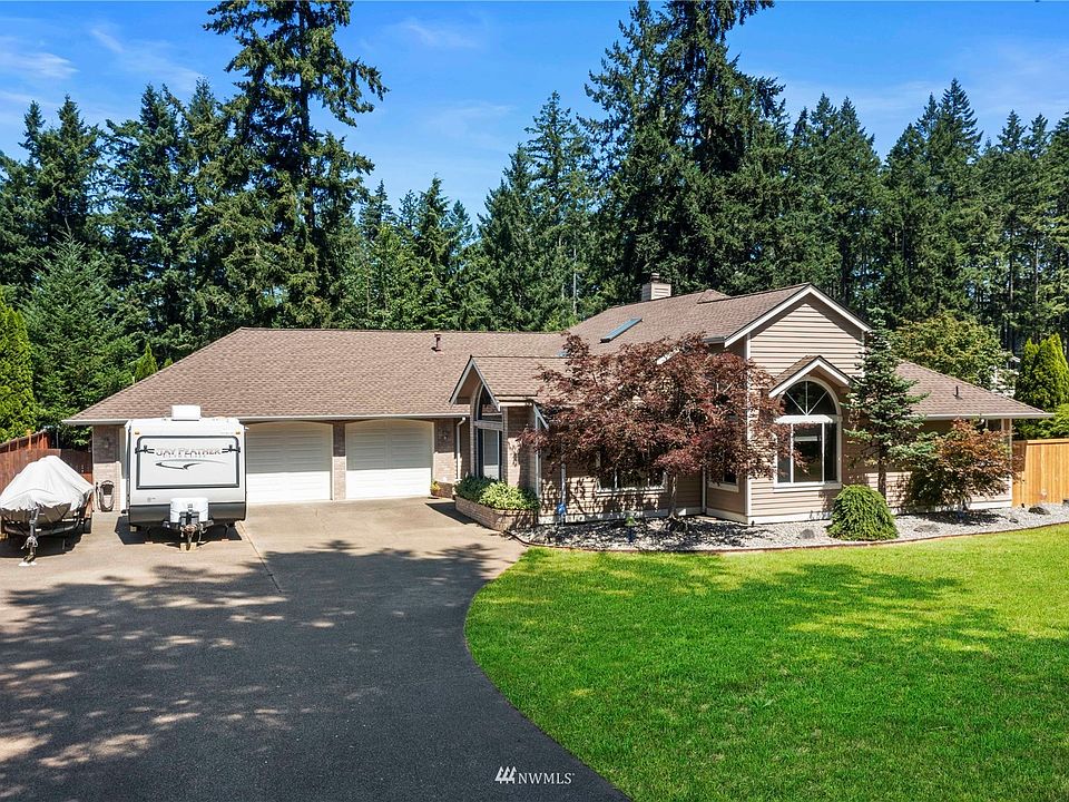Gorgeous 3-bedroom rambler located on a half-acre lot! 3-Car drive through garage and overhead storage racks.>