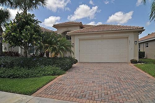 Two Car Garage With Paved Driveway