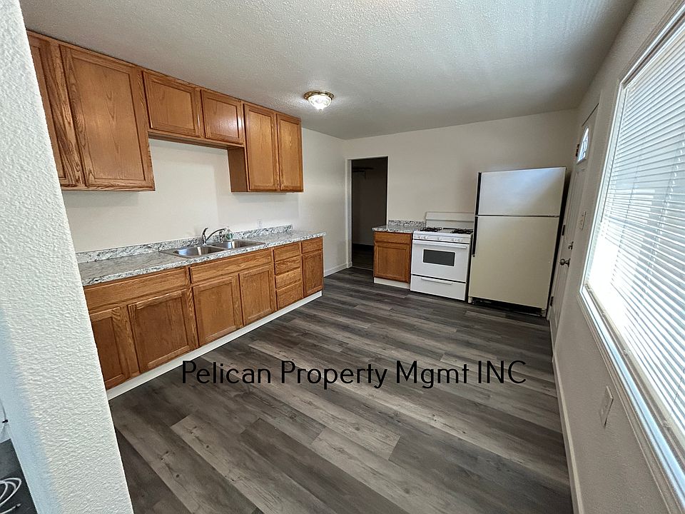 Kitchen from living room, and laundry room doorway