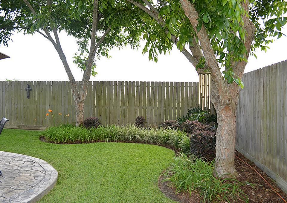 Professionally landscaped with underground sprinkler system and built -in fertilization system
