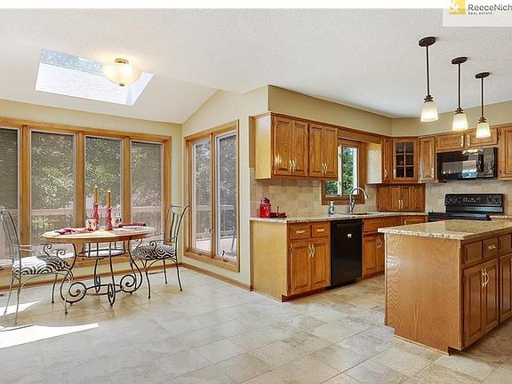 View of sunroom & kitchen from family room.