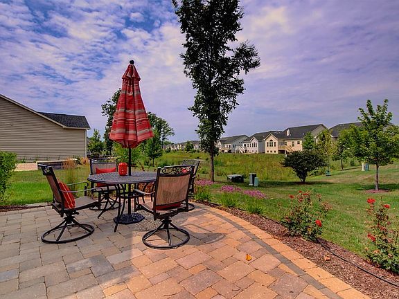 Stone patio overlooks pond