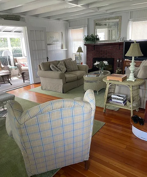 Livingroom area, out to screened in porch.