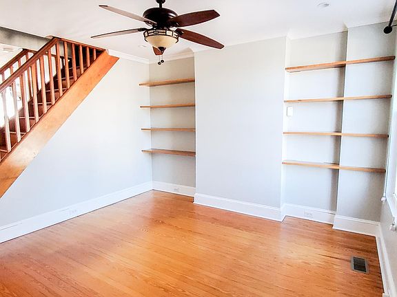 Living room from with custom built-in shelves. View from front entry.