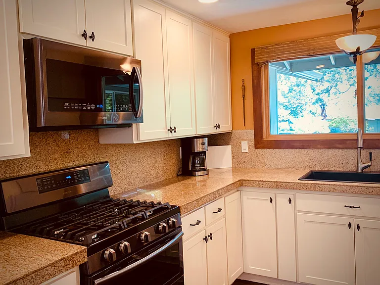 Gas range and microwave as well as tons of storage space. Also includes all the dishes and other needed items for a kitchen!