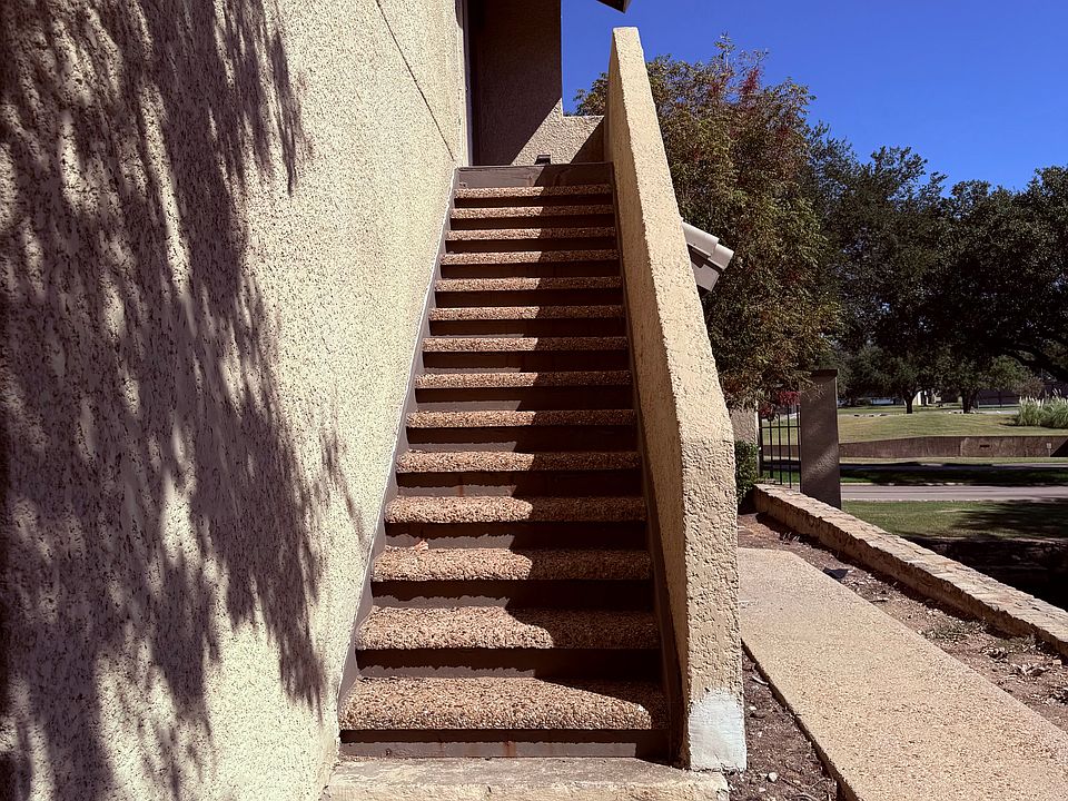 private entrance next to a water fountain