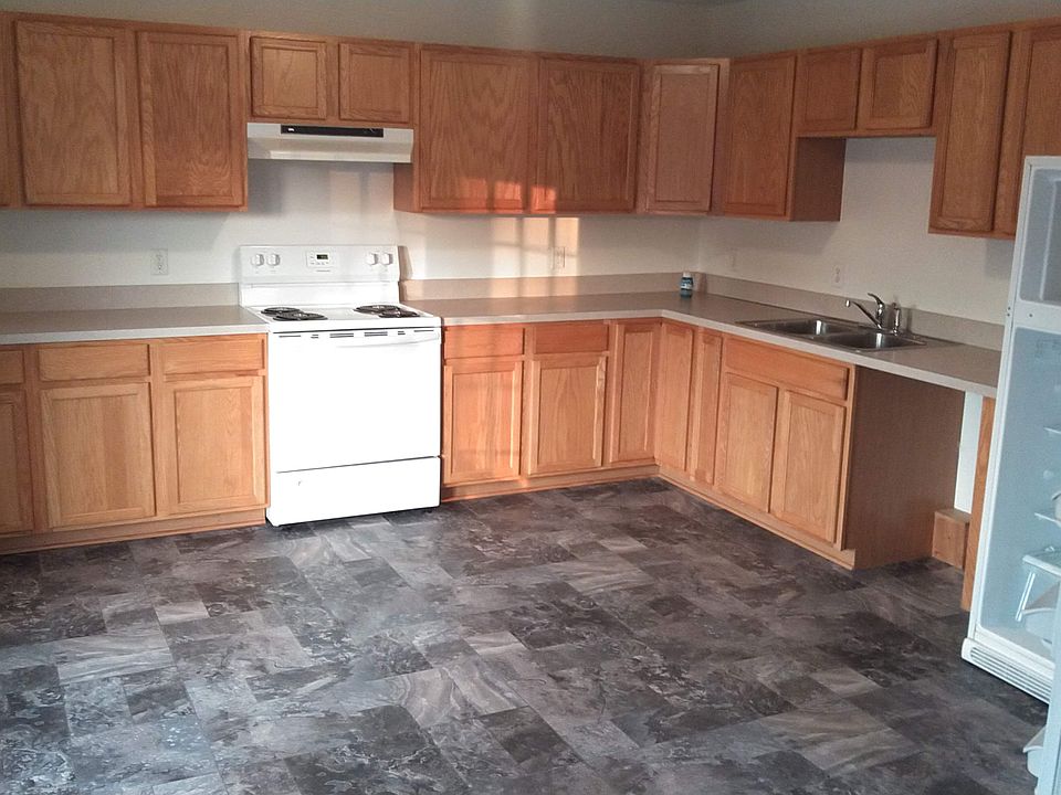 Large eat-in kitchen with newer floor and lots of cabinets