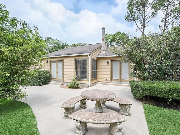 Fromt Seating area #2 on the patio, view of the Dining Room immediately to the right and the Windows and
French Doors of the Family Living area just beyond.