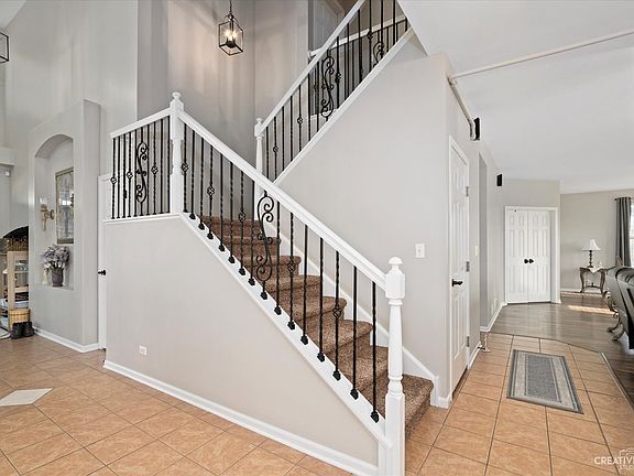 There is an impressive staircase that greets you as you enter the home.