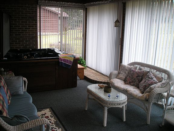 Relax in the sunroom with hotub