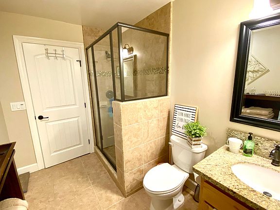 Main bath with beautiful tiled shower.