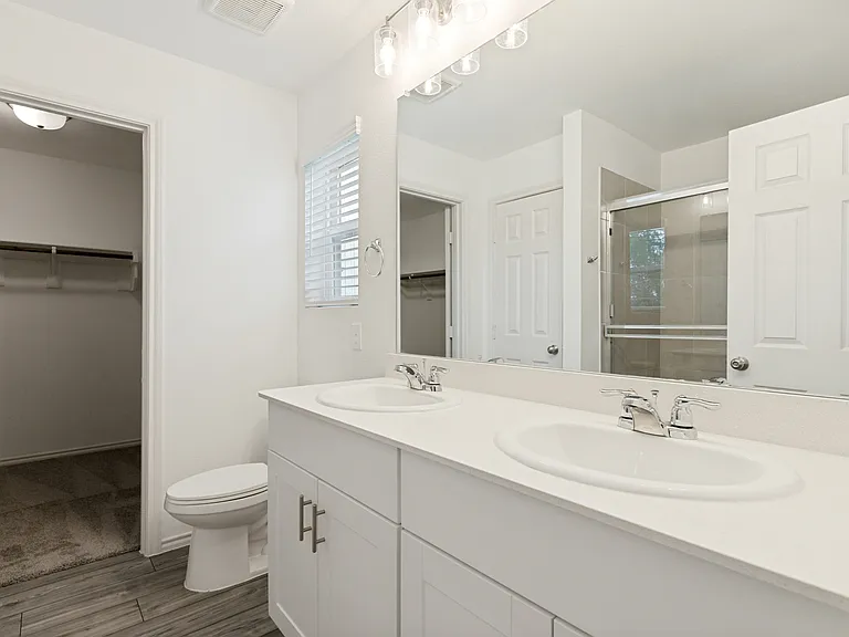 Primary ensuite with double sinks, HUGE closet and linen cabinet.