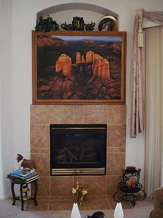 Big TV nook above fireplace, behind pic.