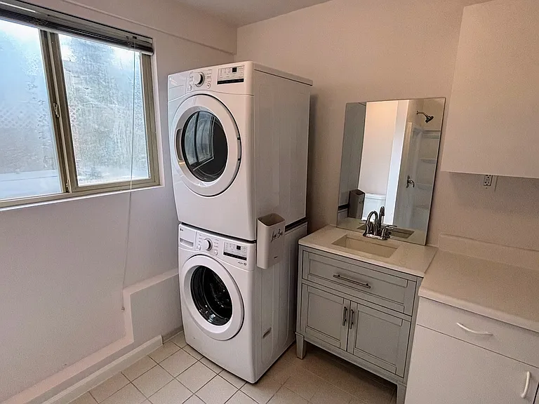 Brand new in-unit washer and dryer. Bathroom sink. And plenty of cabinets for storage.