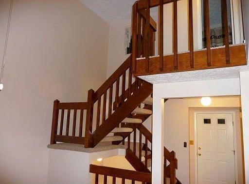 Wonderful open staircase accents the two story living room!