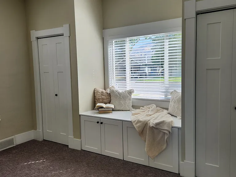 2nd bedroom on main floor with 2 closets and reading nook