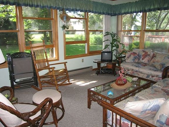 warm 3 season porch overlooks groomed grounds