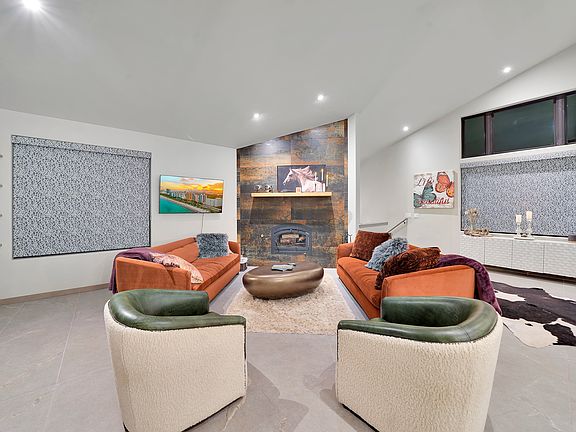 Comfortable sofas and barrel chairs to gather and chat or watch a movie